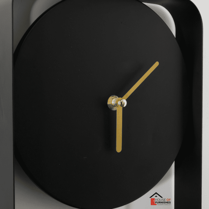 Matte Black Metal Wall Clock with Gold Details in Classic Interior Setting