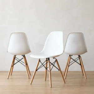 White dining chairs — Eames DSW style front view, stackable molded side chair
