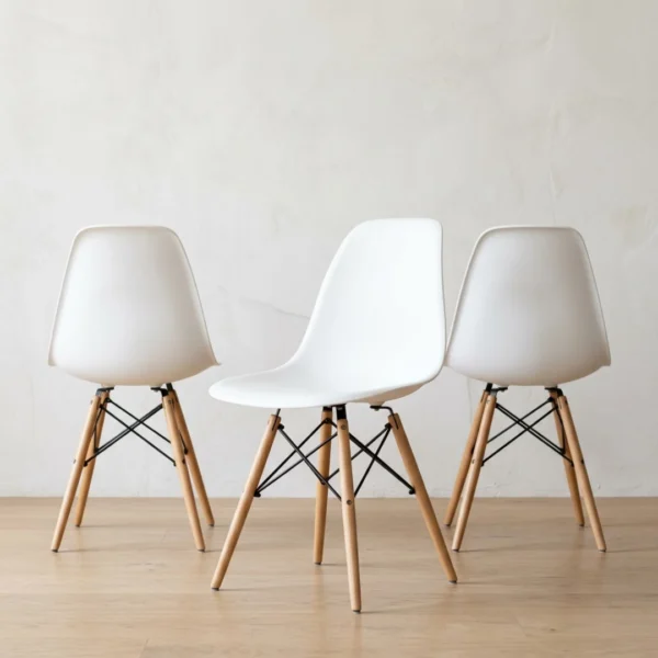 White dining chairs — Eames DSW style front view, stackable molded side chair